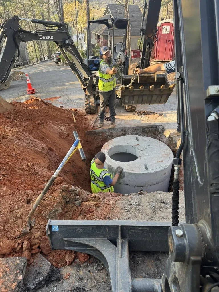 Armor Plumbing crew performing underground plumbing installation in Big Canoe, GA